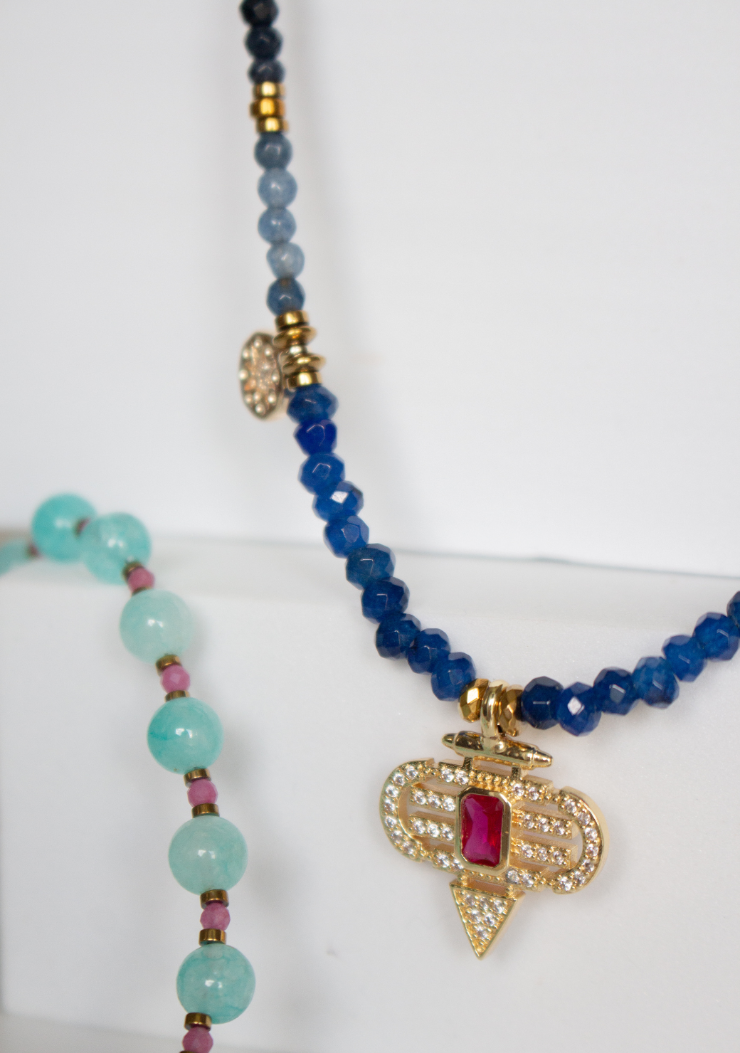 Blue Rondelle Necklace with Red Aztec Pendant