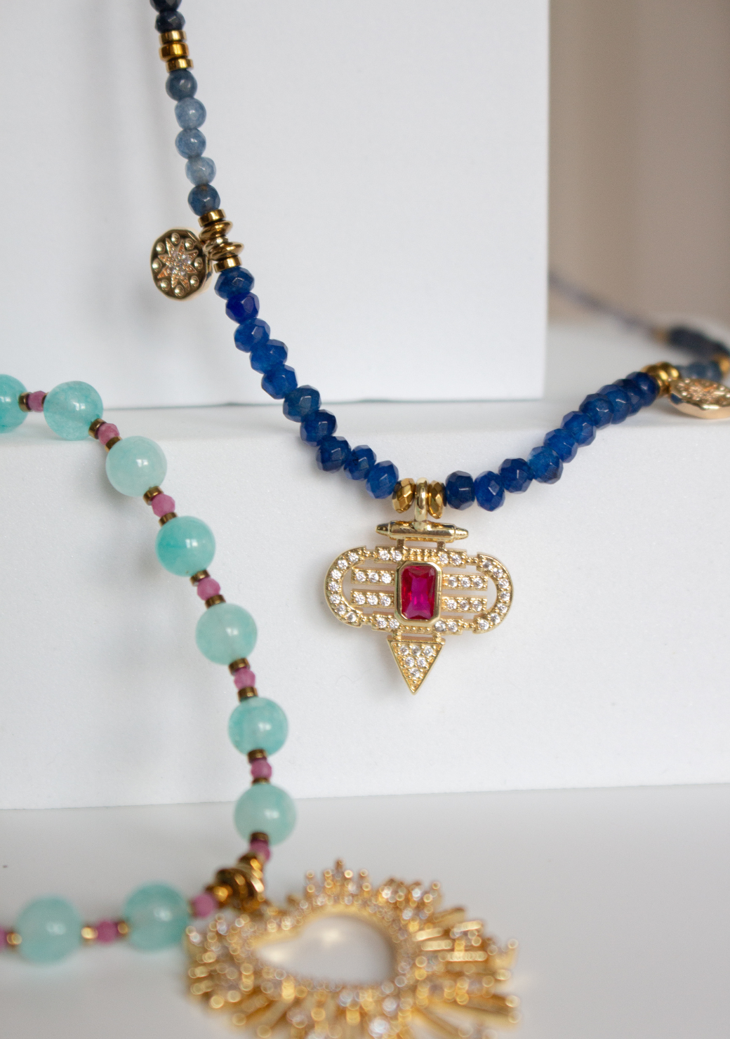 Blue Rondelle Necklace with Red Aztec Pendant