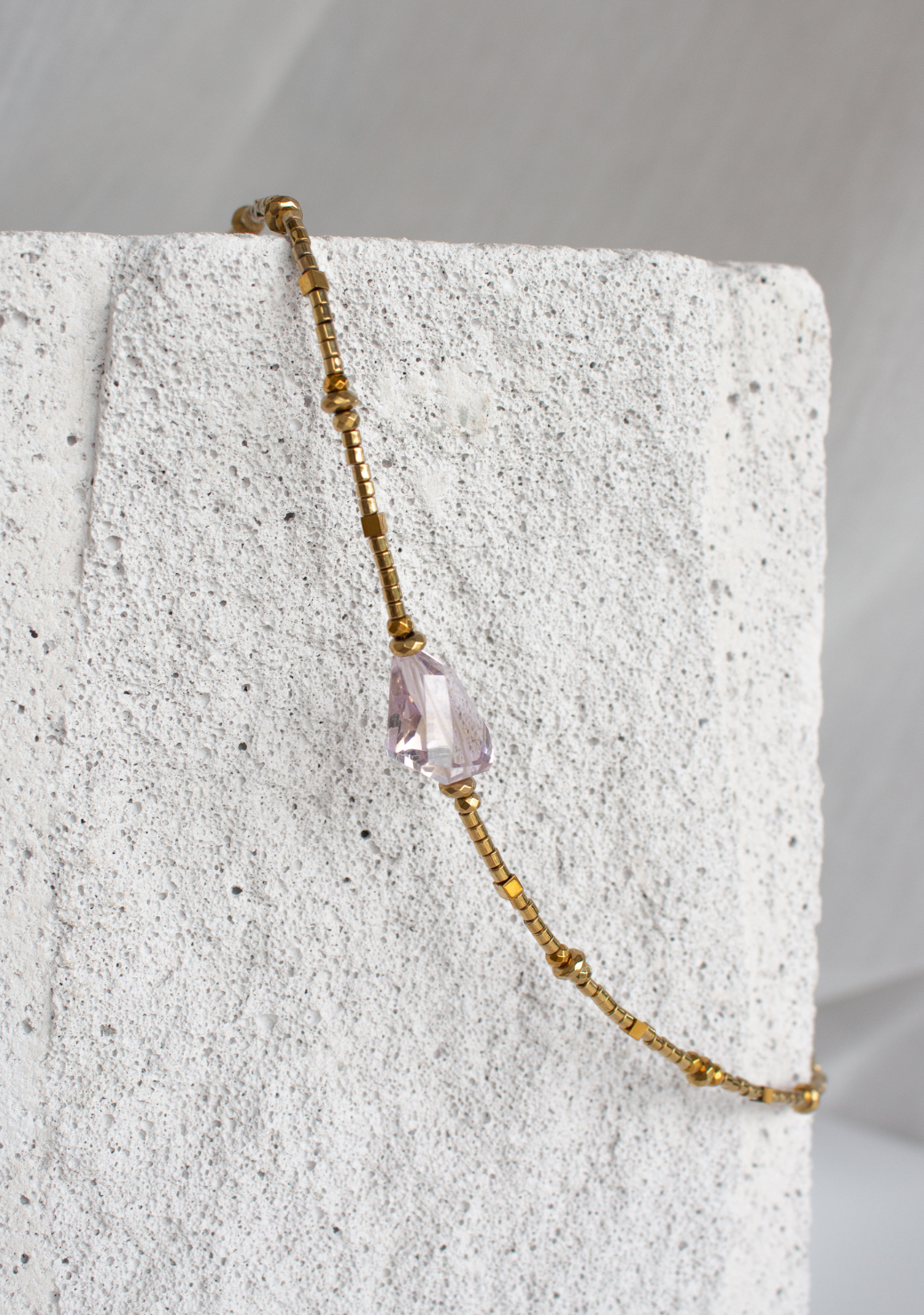 Ethereal Necklace in Smooth Gold Hematite with Amethyst Centre